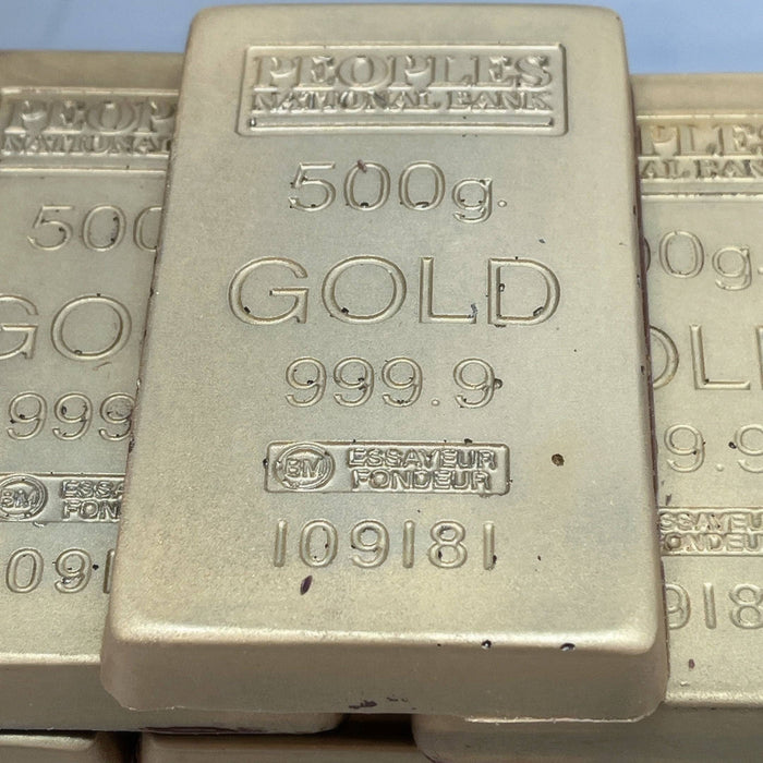 Dubai Gold Chocolate Bar - Limited Edition Luxury designed to resemble a 500g gold bullion with 999.9 purity markings. Edible chocolate in gold foil wrap.