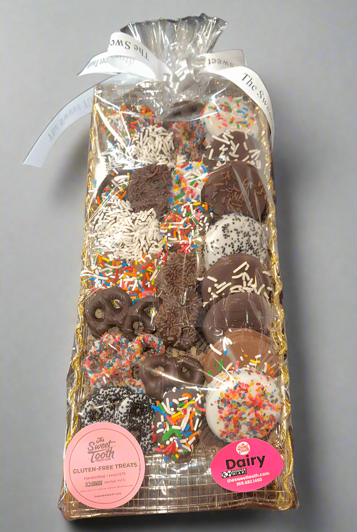Packaged chocolate treats with sprinkles on a wooden surface