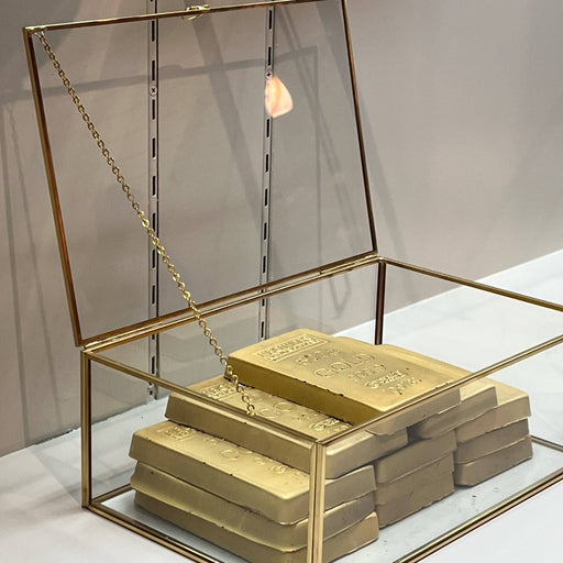 Dubai Gold Chocolate Bar - Limited Edition Luxury set featuring 12 gold-wrapped chocolate bars in a clear glass and gold display case.