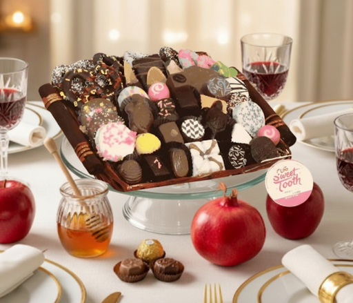 A chocolate gift basket on a beautiful table for Rosh Hashana
