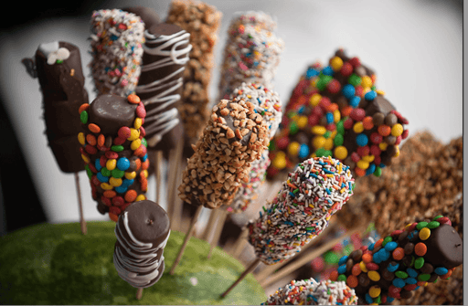 Chocolate Covered Marshmallow Pops with colorful sprinkles and candy toppings, ideal for Purim Basket mishloach manot gifts.