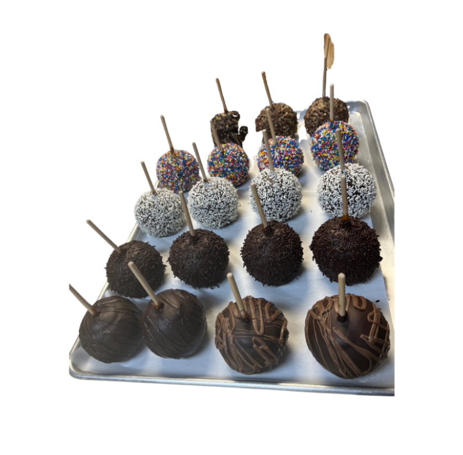 A row of freshly made candy and caramel apples