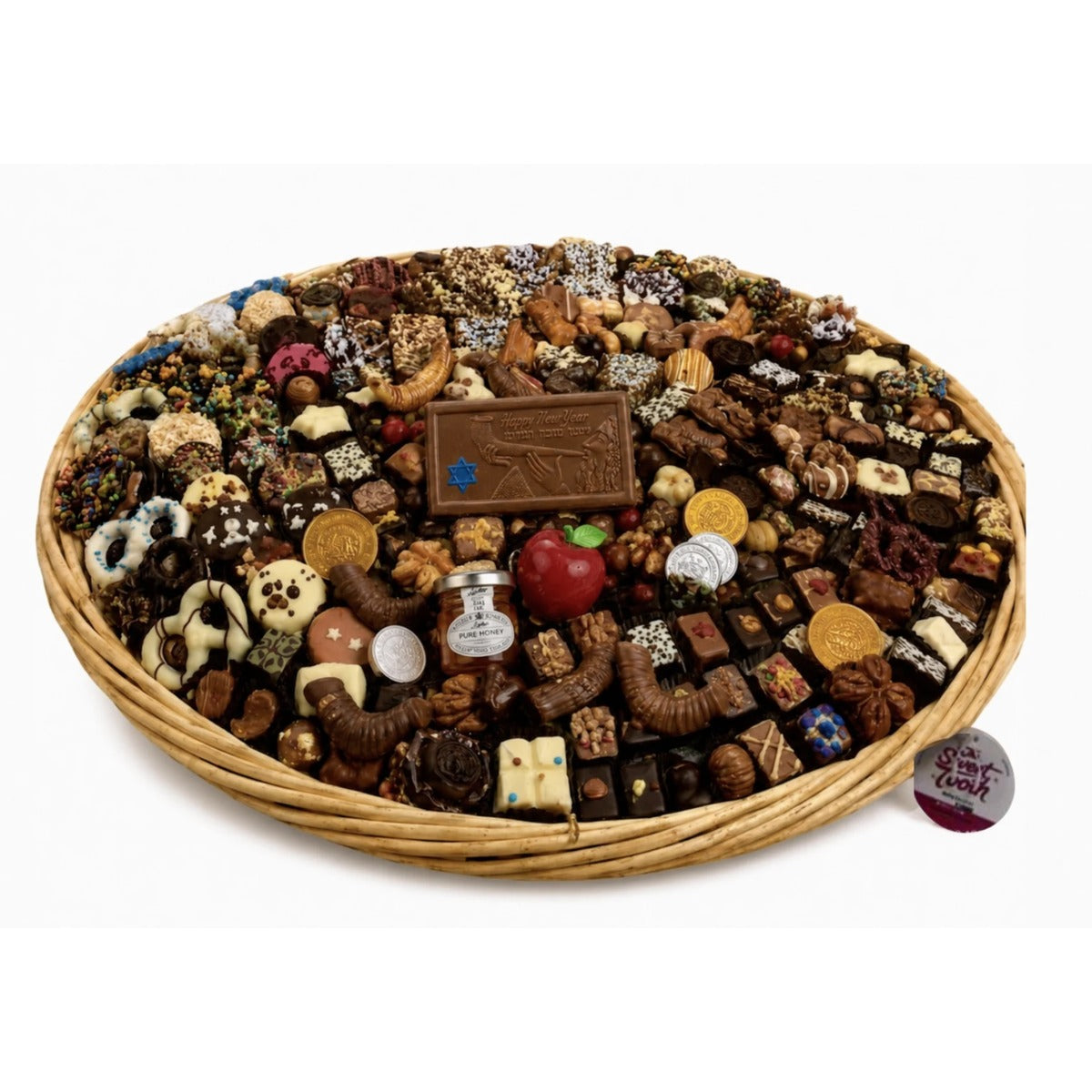 Rosh Hashanah Supreme gift basket piled with kosher chocolates, Happy New Year chocolate plaque, honey jar, red apple chocolate, gold coins, and chocolate shofars from The Sweet Tooth