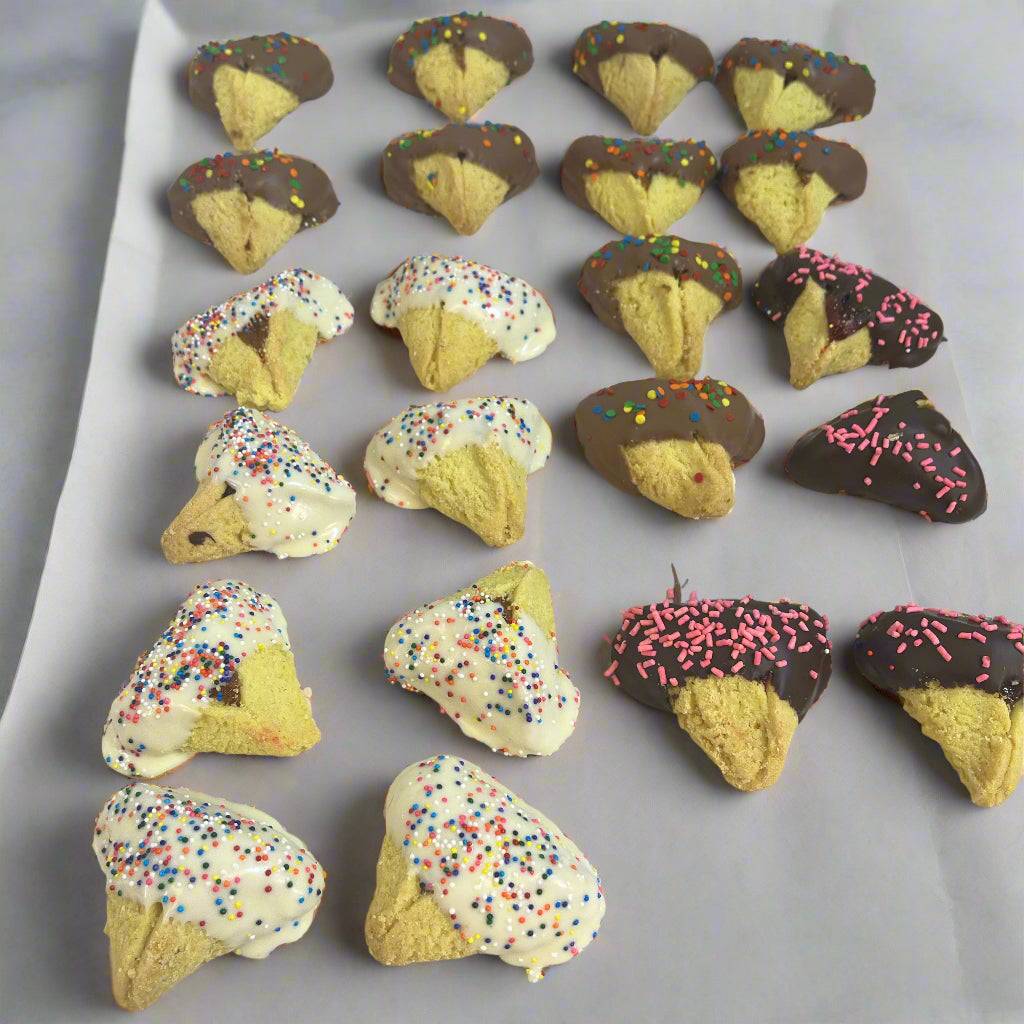 Variety of Hamantaschen -Chocolate-Dipped cookies with white and dark chocolate coatings and colorful sprinkles, ideal for Purim treats.
