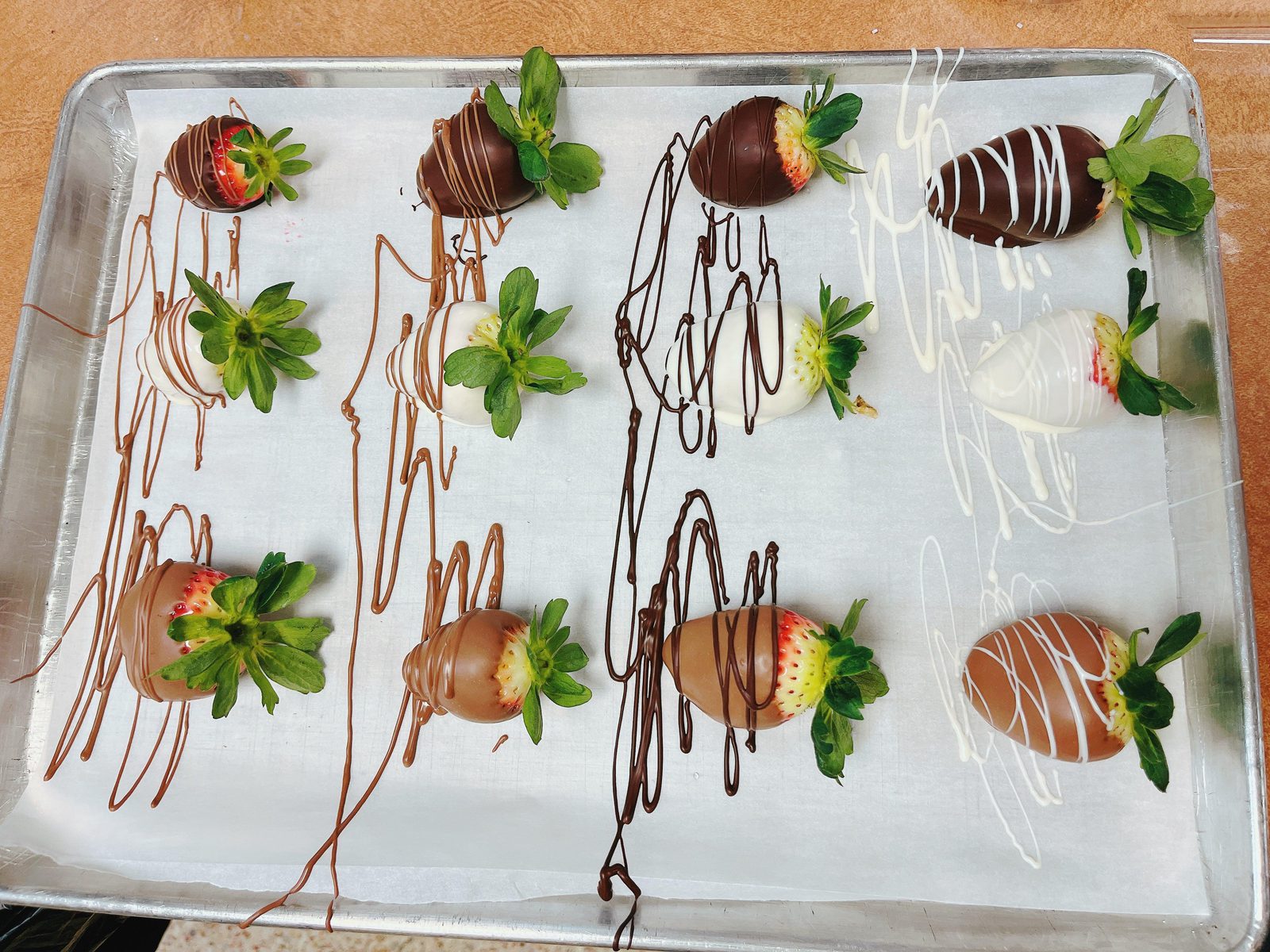 Tray of gourmet chocolate-covered strawberries in milk, dark, and white chocolate from The Ultimate Valentine’s Day Bundle.