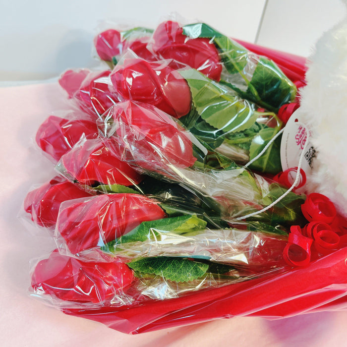 Wrapped red chocolate roses arranged in a bouquet, designed for Valentine's Day or themed party decorations and gifts.