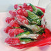Wrapped red chocolate roses arranged in a bouquet, designed for Valentine's Day or themed party decorations and gifts.