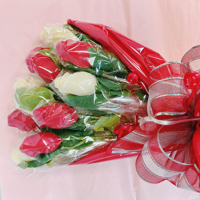 Close-up of chocolate rose bouquet wrapped in red plastic with a Valentine's Day ribbon, ideal for romantic party gifting.