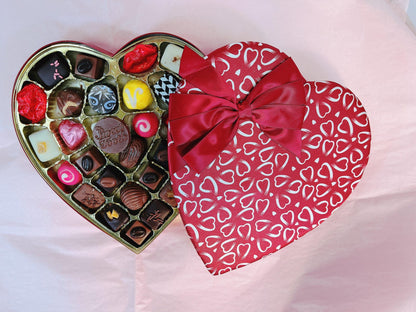 Heart-Shaped Box of Chocolates & Truffles with decorative red lid partially open, displaying assorted chocolate-covered fruit treats.
