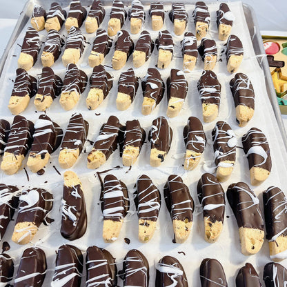 Chocolate-dipped biscotti with white drizzle from SUPREME - Passover, a gourmet addition to premium food gift baskets.