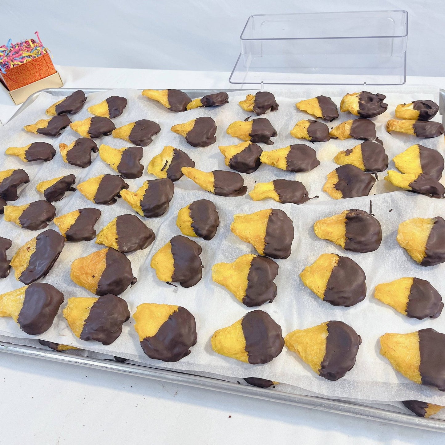 Chocolate-dipped hamantaschen cookies from SUPREME - Passover, a festive treat for holiday food gift assortments.