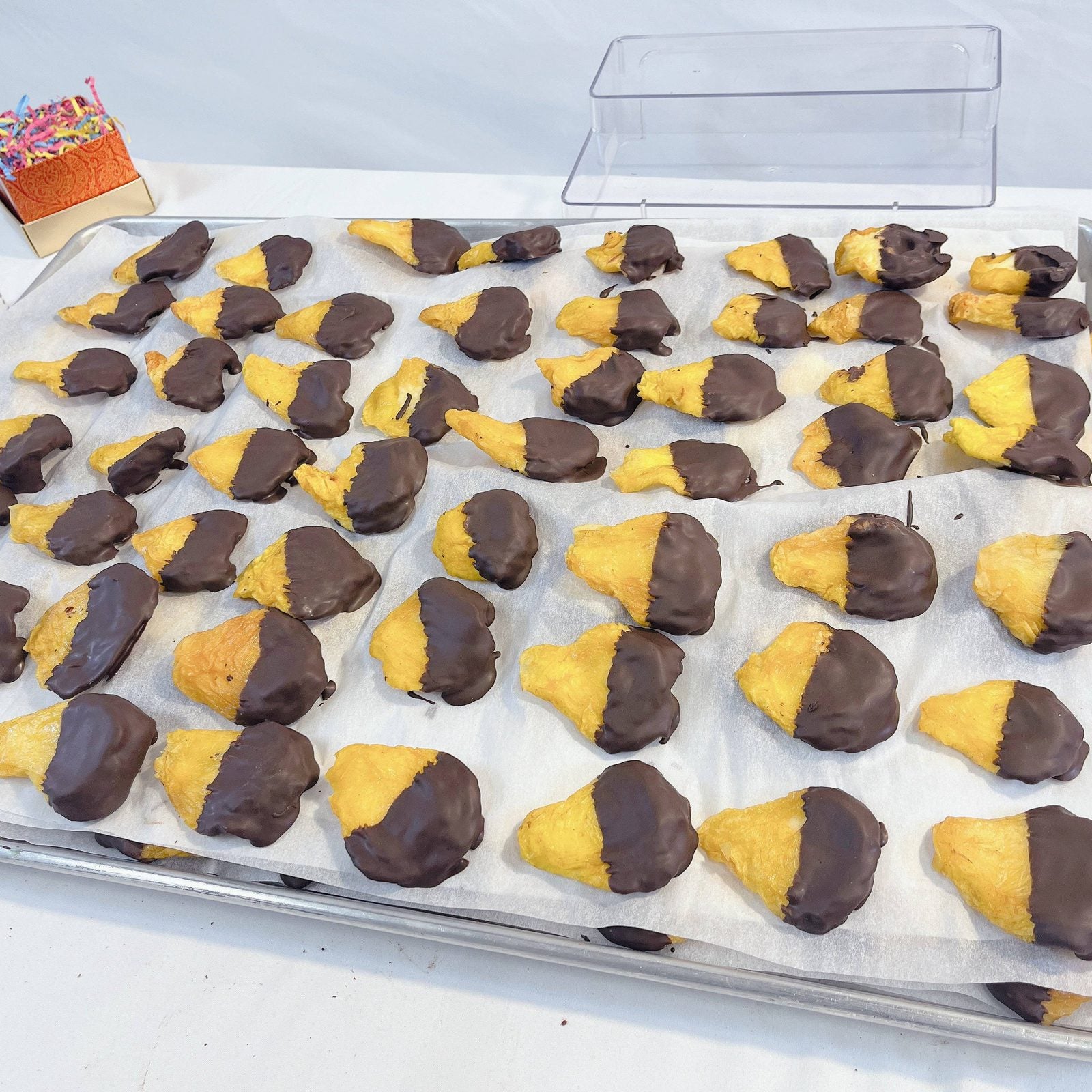 Chocolate-dipped hamantaschen cookies from SUPREME - Passover, a festive treat for holiday food gift assortments.