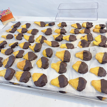 Chocolate-dipped hamantaschen cookies from SUPREME - Passover, a festive treat for holiday food gift assortments.