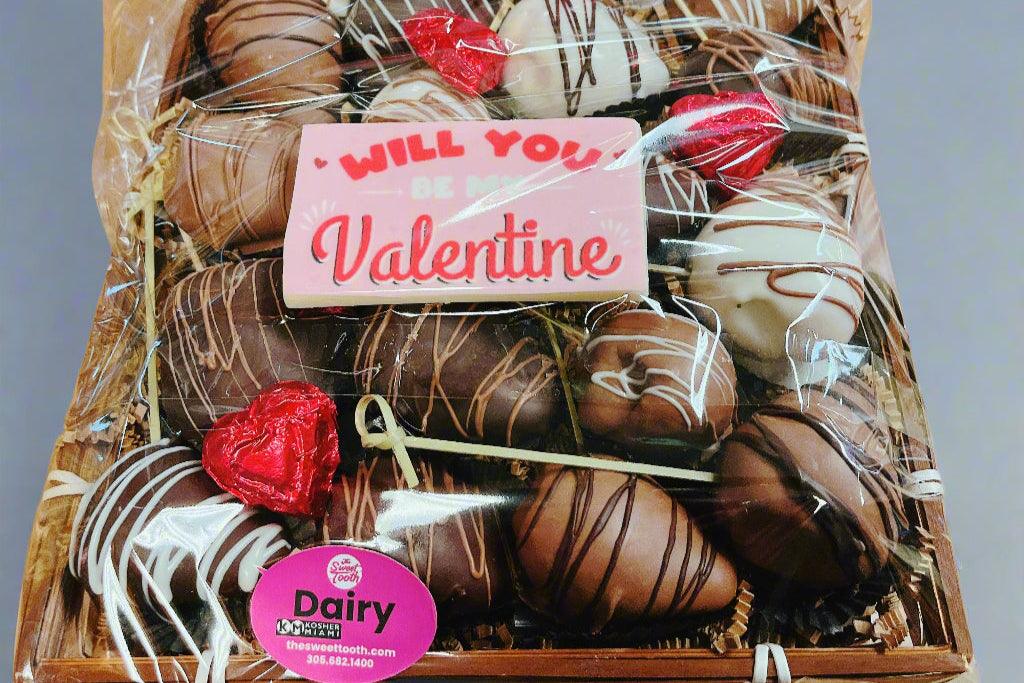 Nutella filled chocolate covered strawberries in a Valentine's Day gift box with heart-shaped chocolates, perfect for delivery in Miami Aventura Florida.