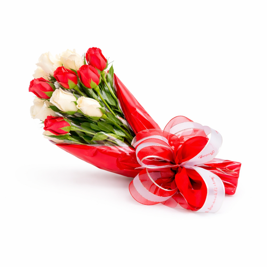 Bouquet of red and white flowers wrapped in cellophane with a decorative bow wrapped with ribbon, handcrafted gift, The Sweet Tooth North Miami Beach since 1979