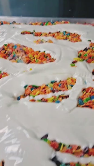 Fruity Pebbles white chocolate bark being mixed, portioned, and shown in finished pieces at The Sweet Tooth