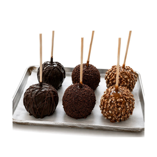 Six chocolate and caramel dipped apples on a tray