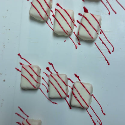 White chocolate truffles with red stripes from The Sweet Tooth