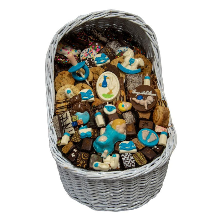Large Baby Boy Bassinet Gift Basket featuring gourmet sweets and blue baby-themed decorations, ideal for baby showers or christenings.